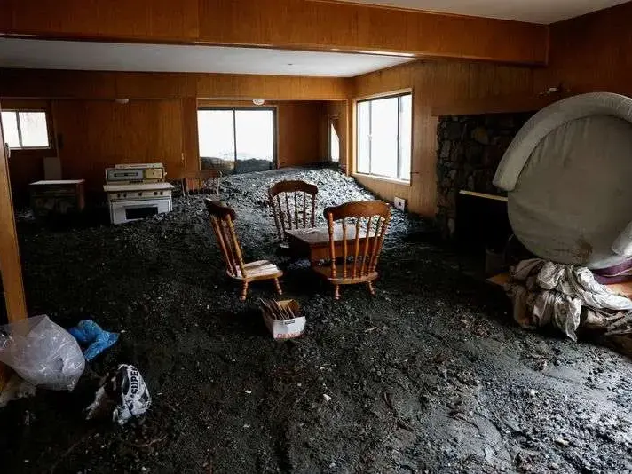 Room left covered in mud and debris after flood water receded